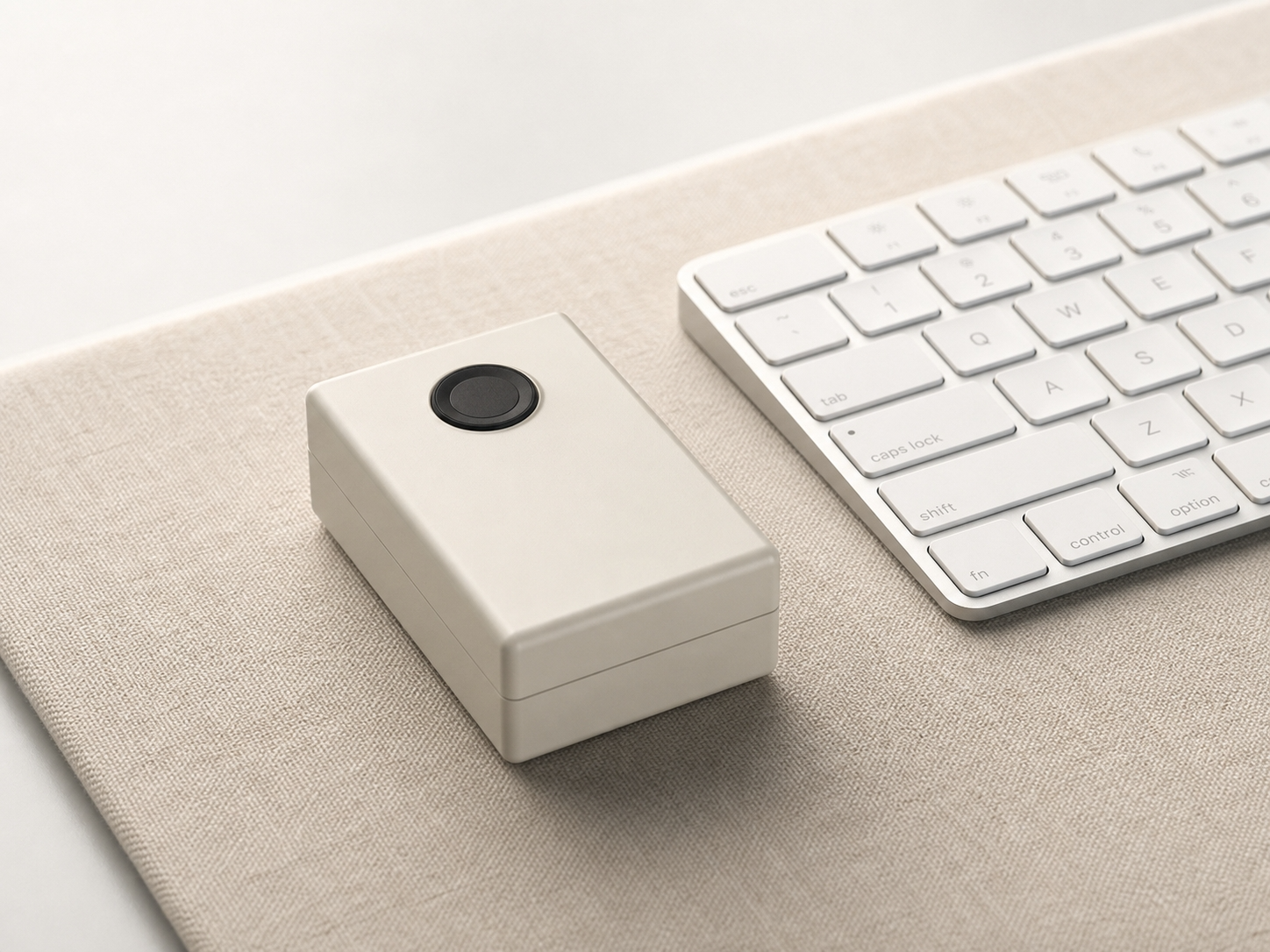 TouchPass — compact USB fingerprint key beside a keyboard
